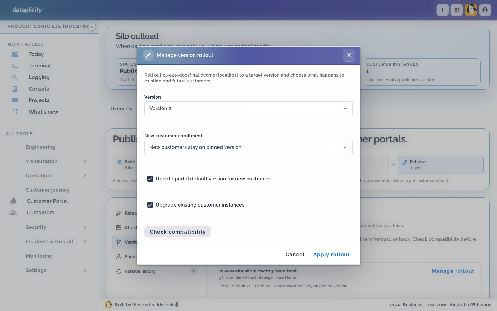 Manage version rollout dialog for the Silo outload portal with version 2 selected, controls for new-customer enrolment and existing-instance upgrades, and a compatibility check